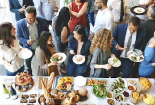 people networking at a buffet