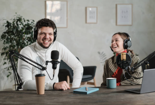 two podcasters laughing